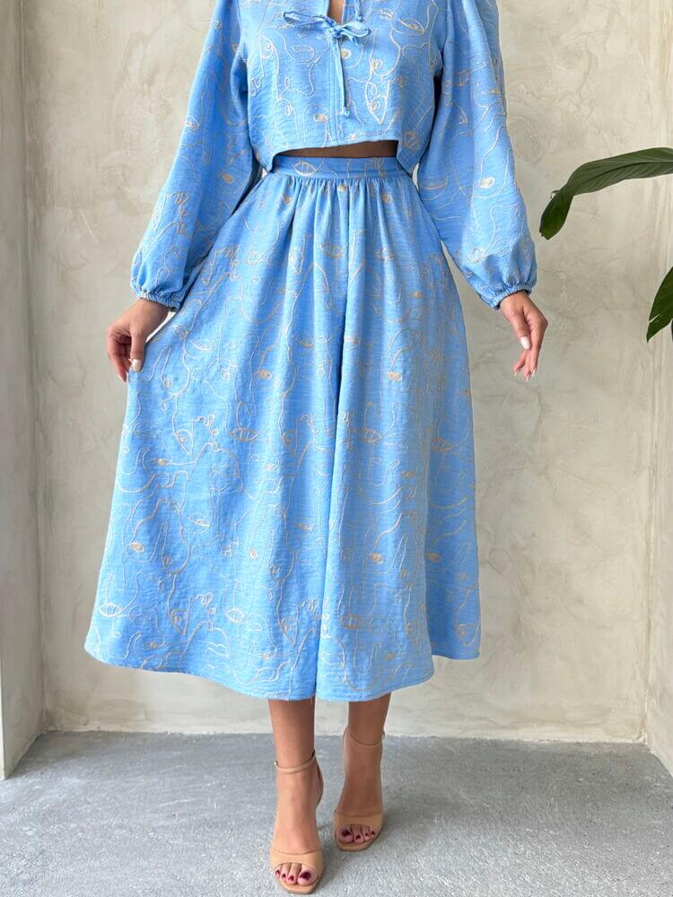 Boho print linen two-piece set featuring a light blue blouse and matching skirt for a stylish summer look.
