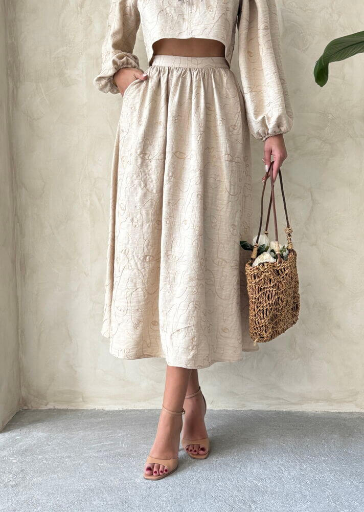 Boho print linen two-piece set featuring a chic blouse and matching skirt, perfect for casual or relaxed gatherings.