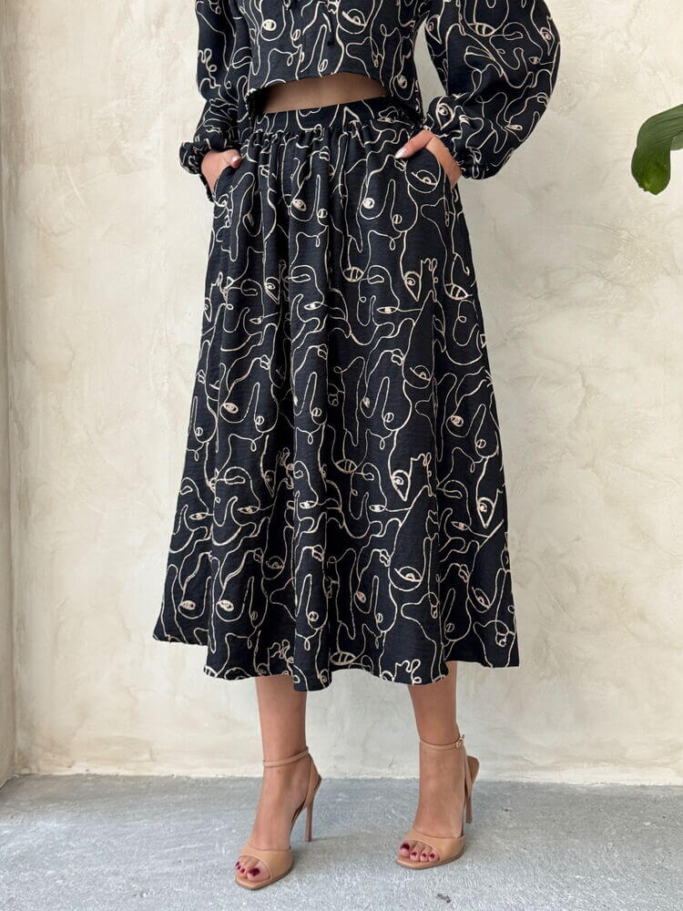 Boho printed linen two-piece set featuring a chic blouse and skirt, ideal for casual and relaxed occasions.