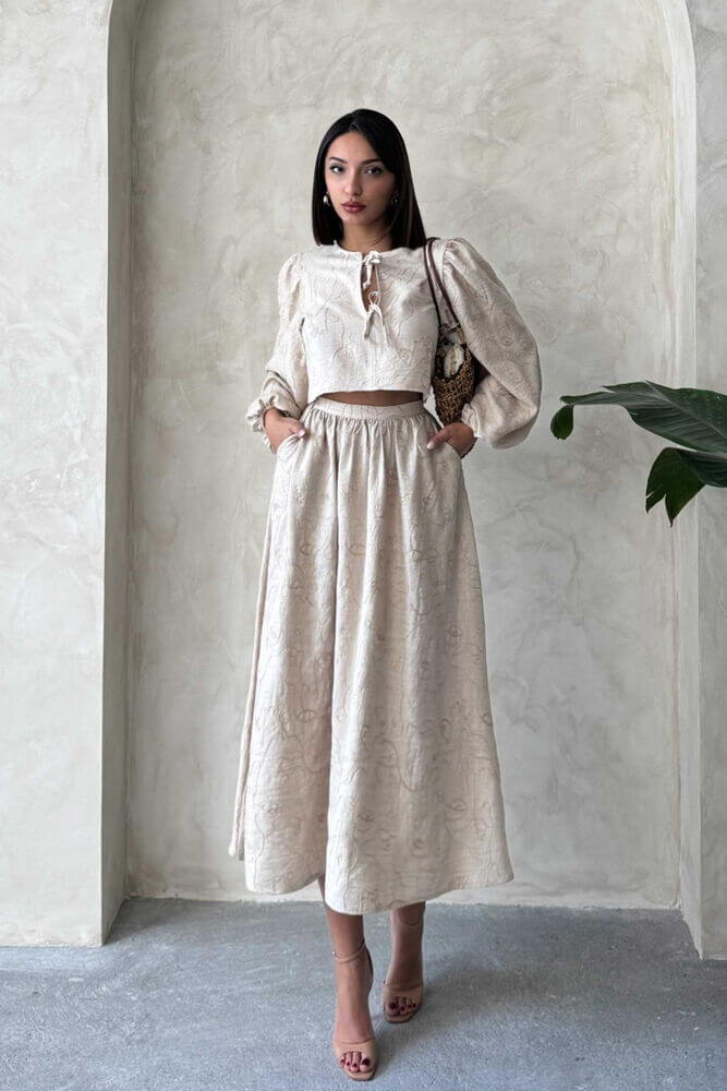 Chic model wearing a Boho print linen two-piece set featuring a blouse and matching skirt.