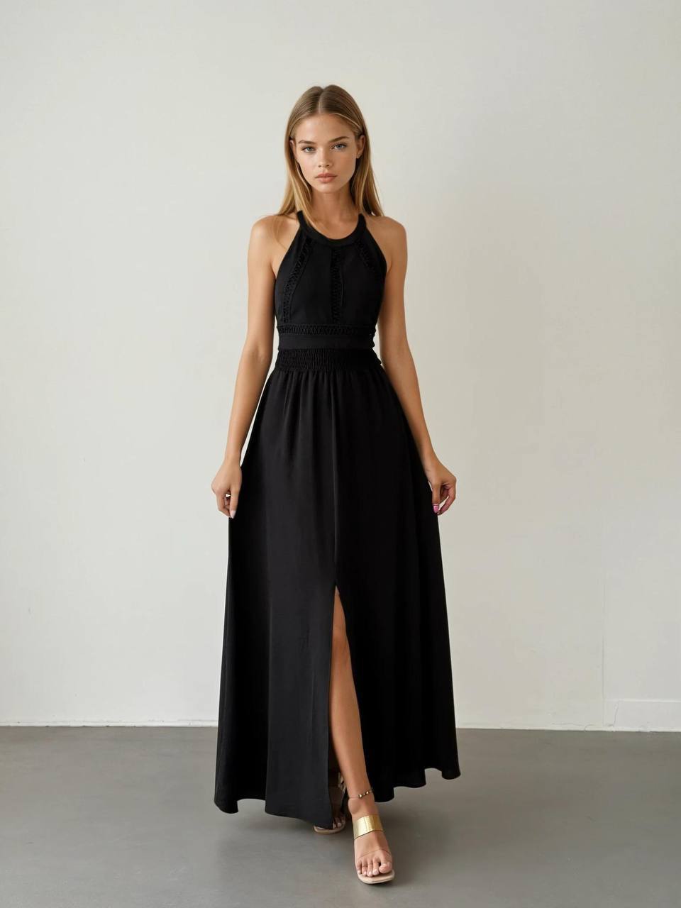 Elegant black boho maxi dress with a graceful silhouette.