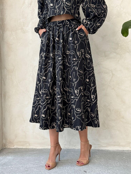 Boho printed linen two-piece set featuring a chic blouse and skirt, ideal for casual and relaxed occasions.