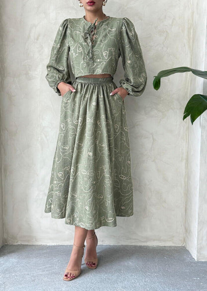 Boho print linen two-piece set featuring a blouse and matching skirt in a light green design, perfect for casual wear.