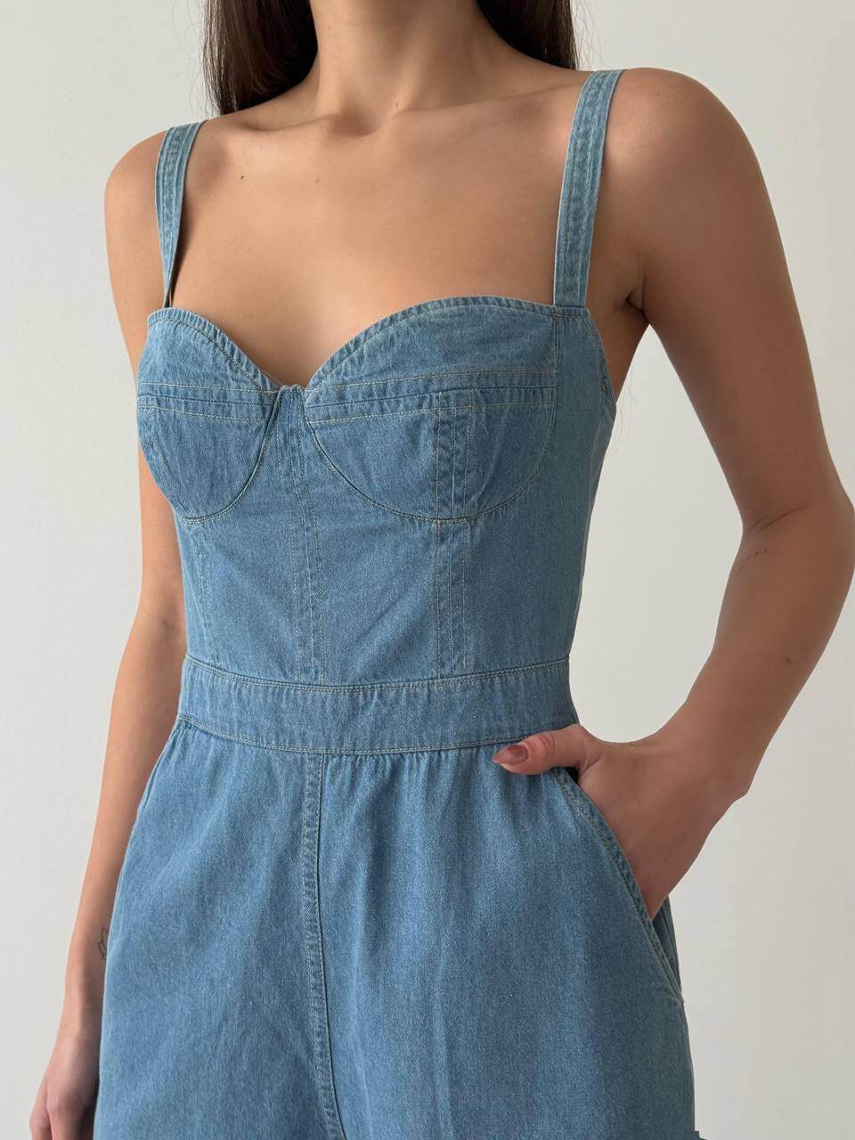 Light blue denim strap romper, detail view