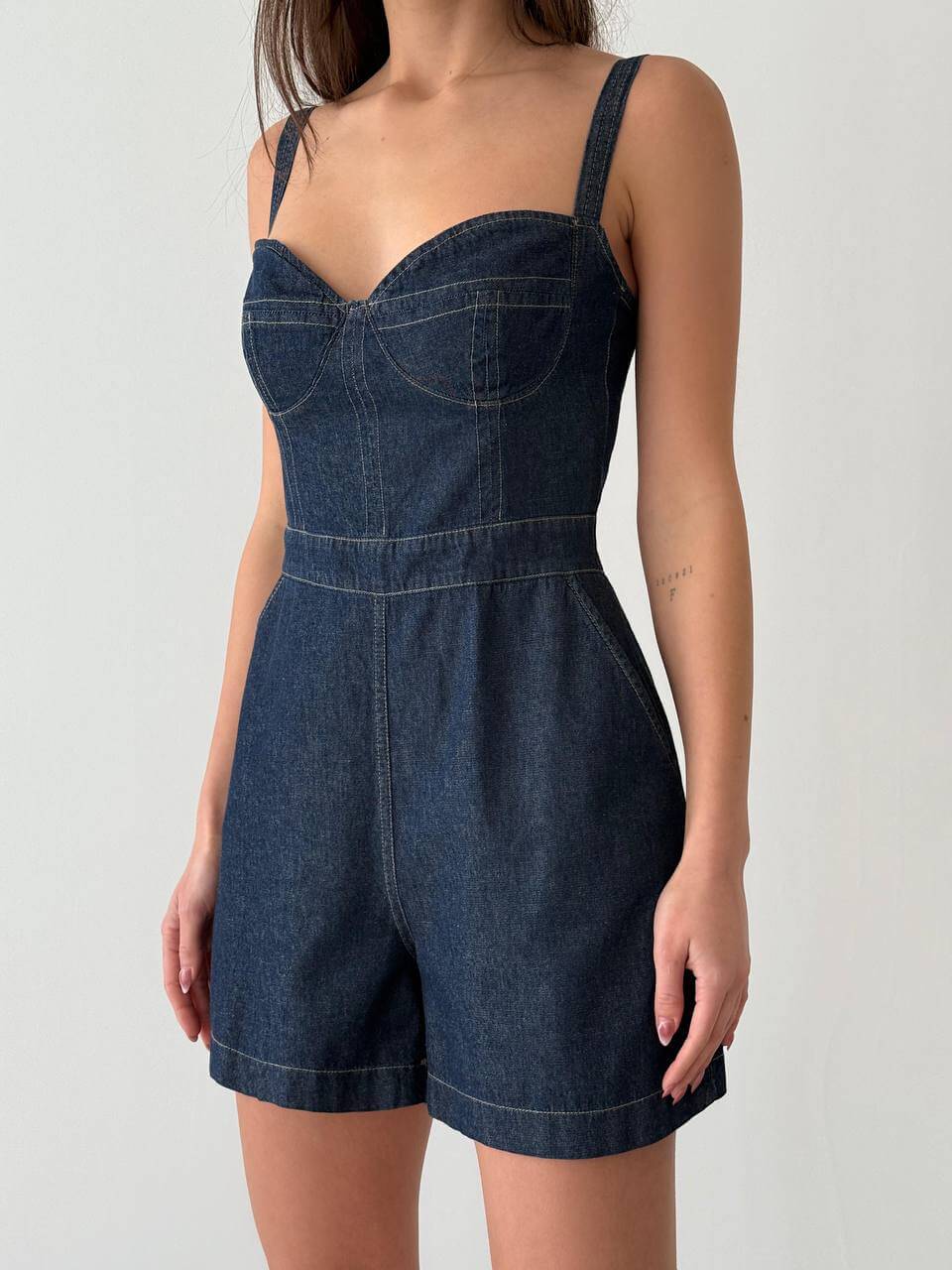 Dark blue denim strap romper, detail view