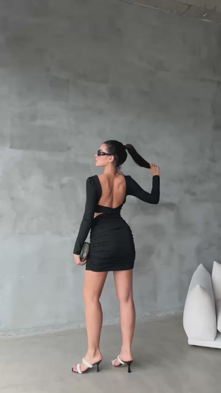 Women's Short Black Skinny Dress with a Bra-Style Top, Open Back, Stretchy Fabric, and Length Below the Hips