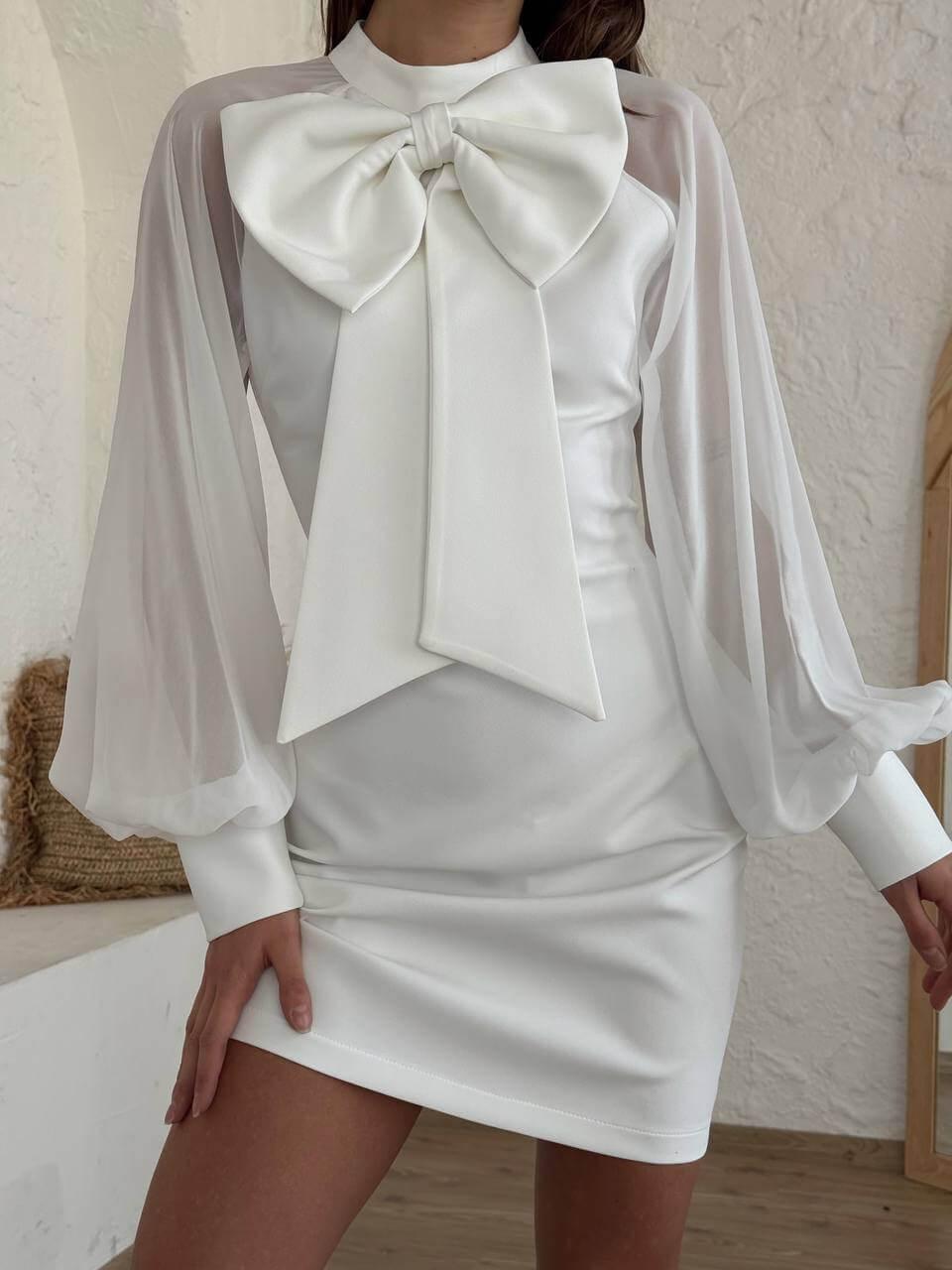 White long-sleeve short dress with a bow-tie collar.