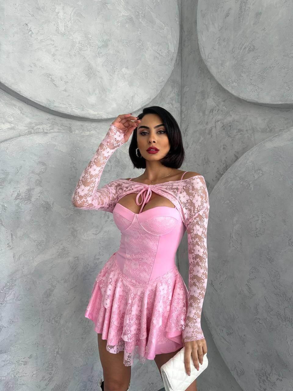Pink princess dress with lace sleeves, featuring intricate lace details and a bust glop with shorts inside. The dress is made of full lycra stretch lace.