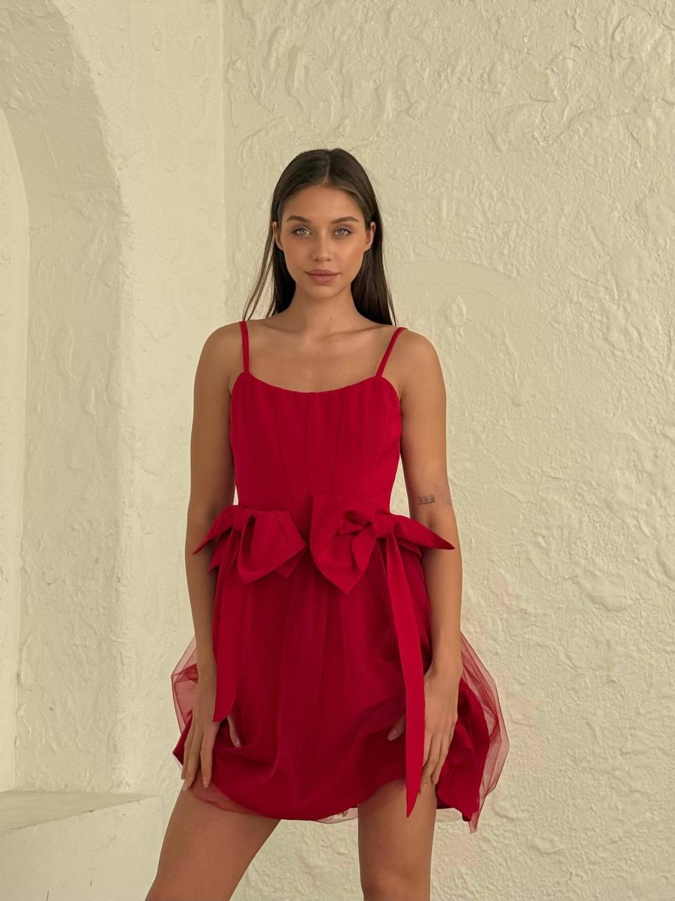 Women's short red sleeveless dress above the knee