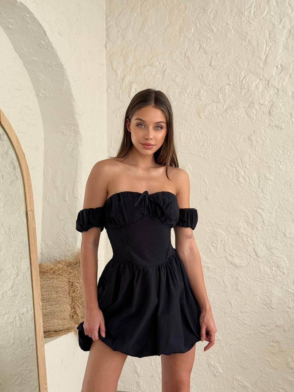 Women's short black dress with off-the-shoulder sleeves