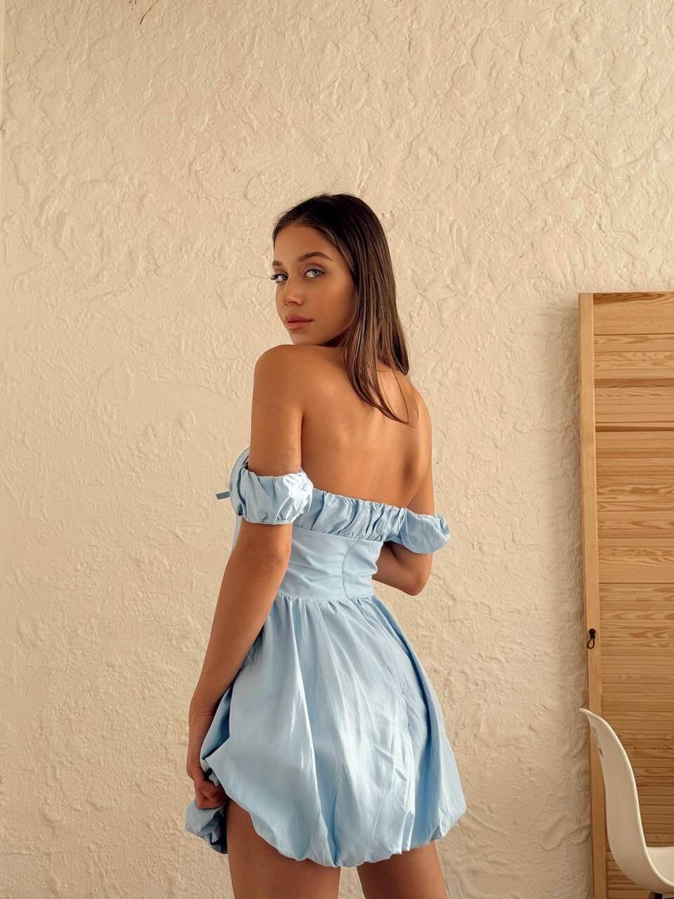 Women's short light blue dress with off-the-shoulder sleeves