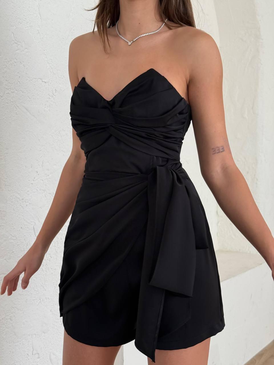 Black strapless short dress.