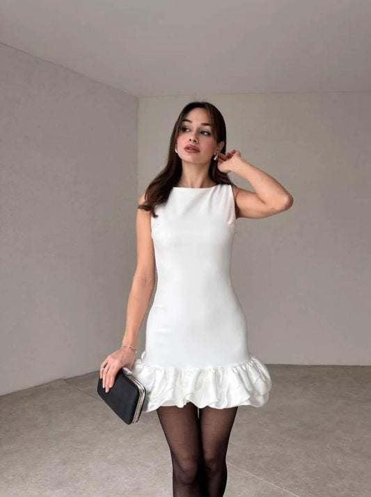 White sleeveless short dress with pin-pleated skirt.