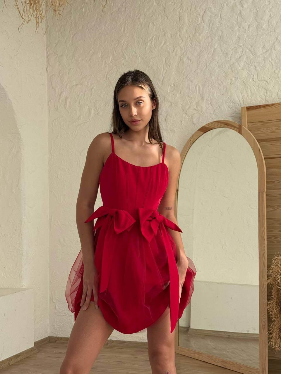 Women's short red sleeveless dress above the knee