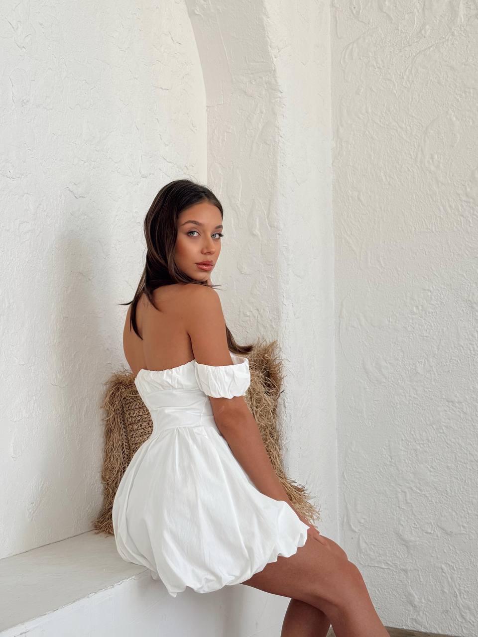 Women's short white dress with off-the-shoulder sleeves
