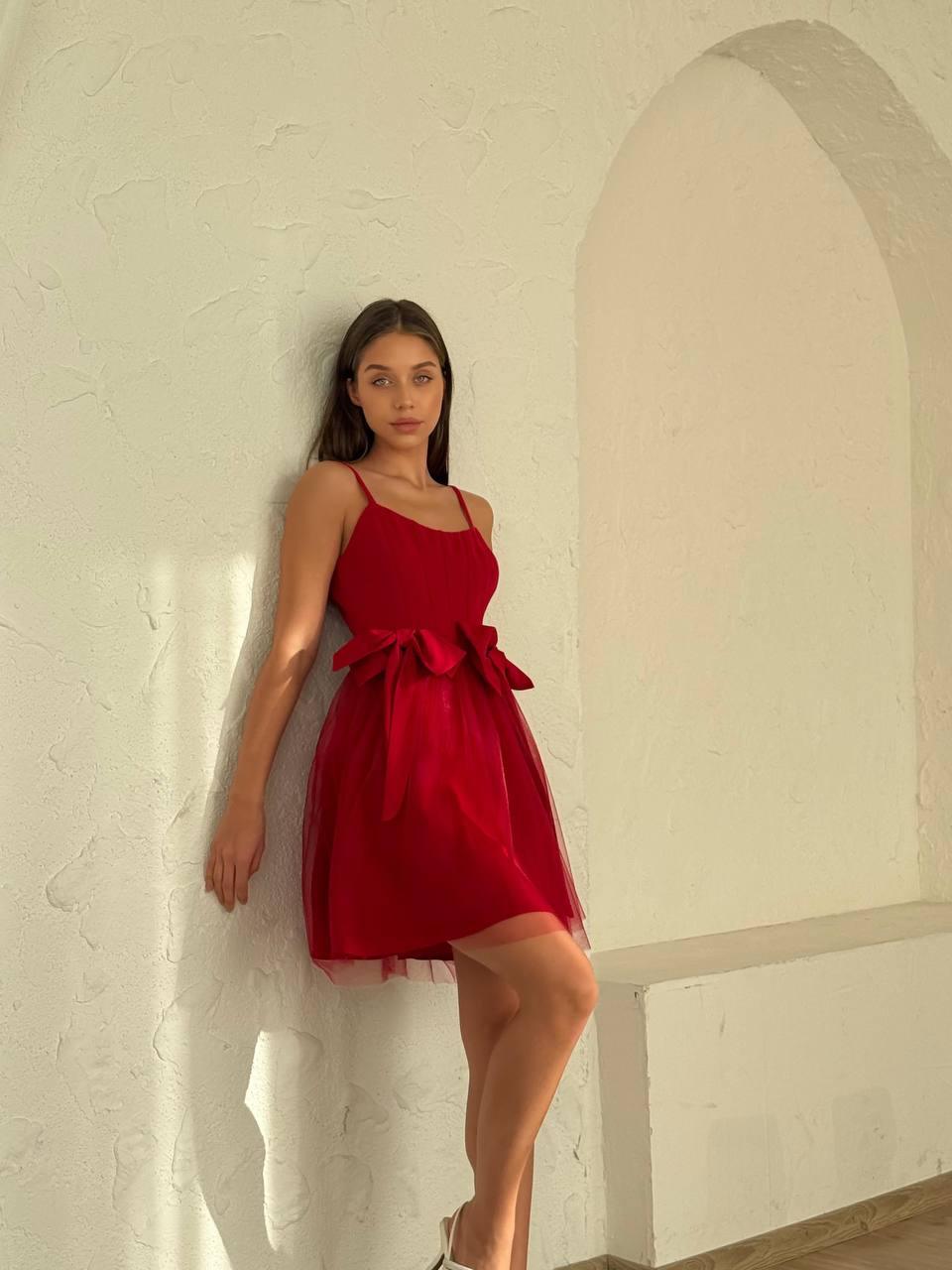 Women's short red sleeveless dress above the knee