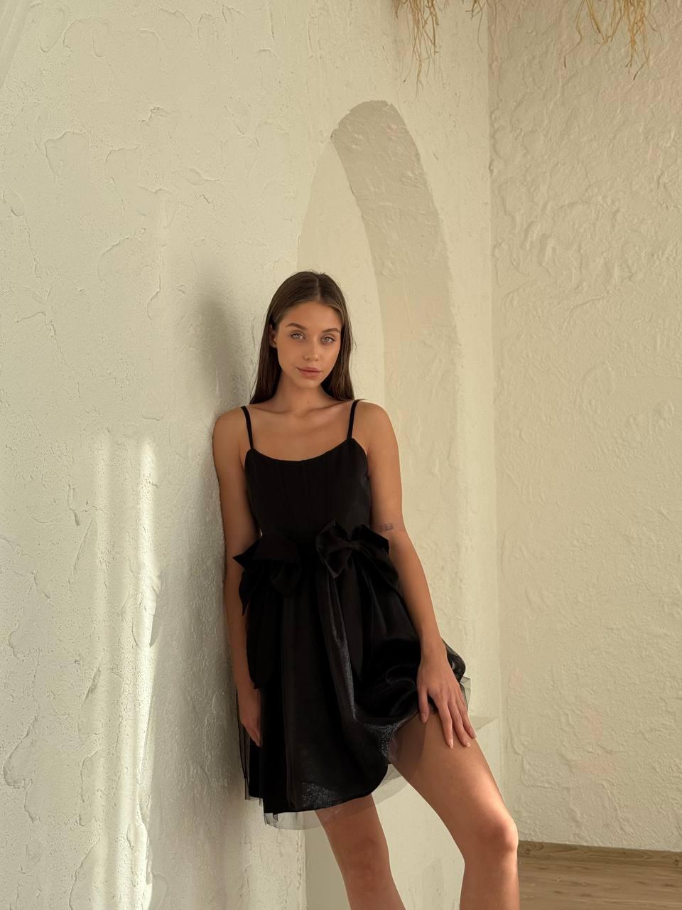 Women's short Black sleeveless dress above the knee