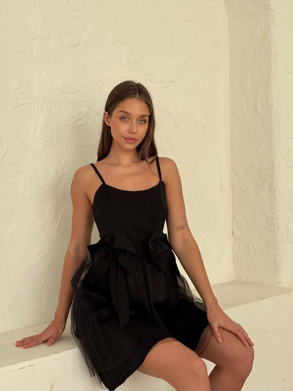 Women's short Black sleeveless dress above the knee