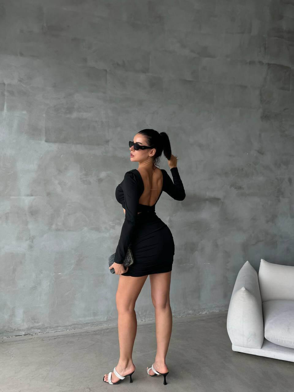 Women's Short Black Skinny Dress with a Bra-Style Top, Open Back, Stretchy Fabric, and Length Below the Hips